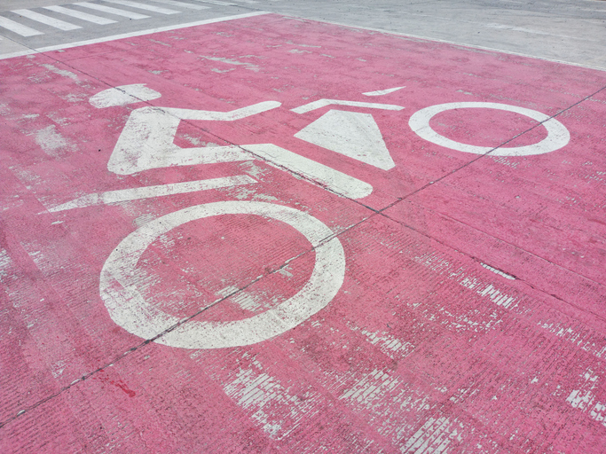 The motorbike stops Lane at a traffic light