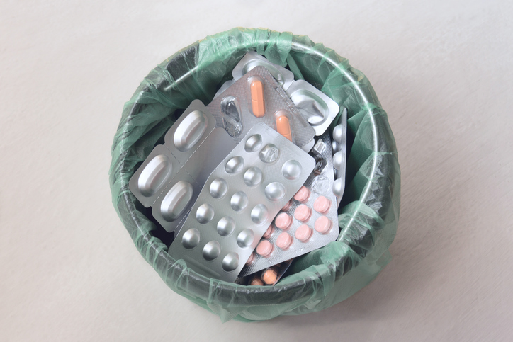 Trash bin with medical pills. Waste of different packages of medicines. Top view