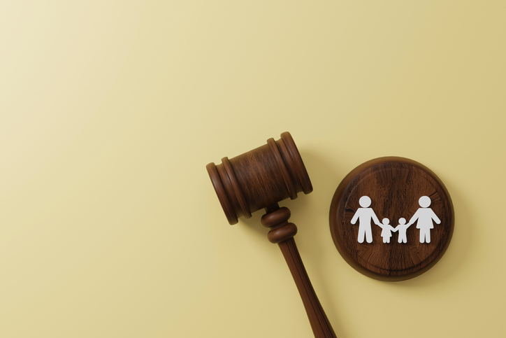 Top view of judge gavel and icon human family. Family law or divorce, legality, adoption concept. 3d illustration